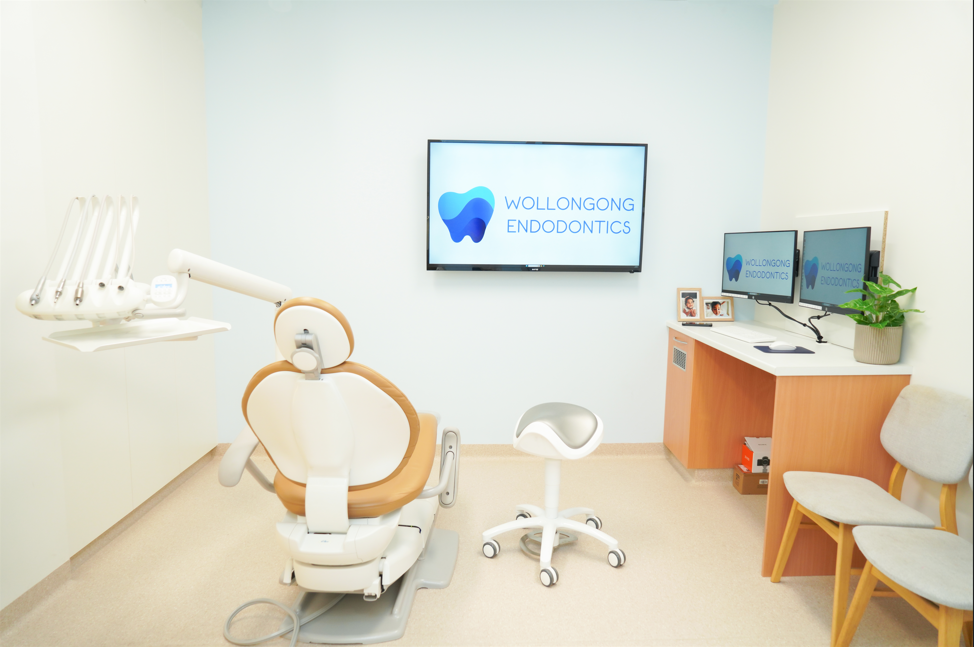 Specialist treatment room featuring operating microscope and dental chair
